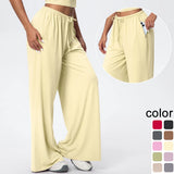 Pantalon de yoga taille haute jaune clair, jambe large à poches, porté, vue de face