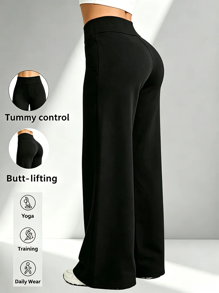 Pantalon de yoga noir taille haute jambe droite, porté, vue de dos