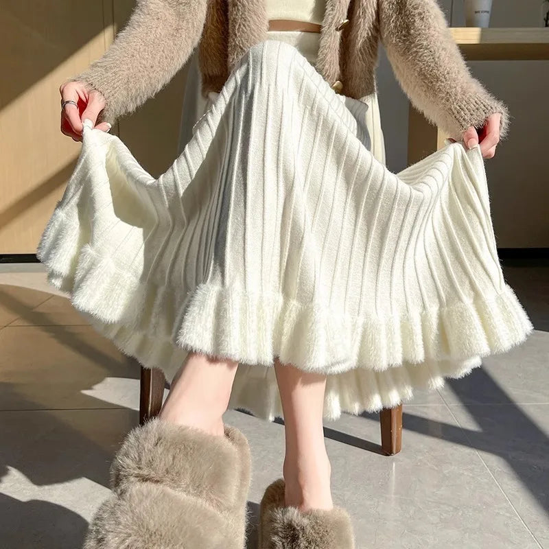 Jupe évasée en maille abricot plissée, tenue déployée, portée